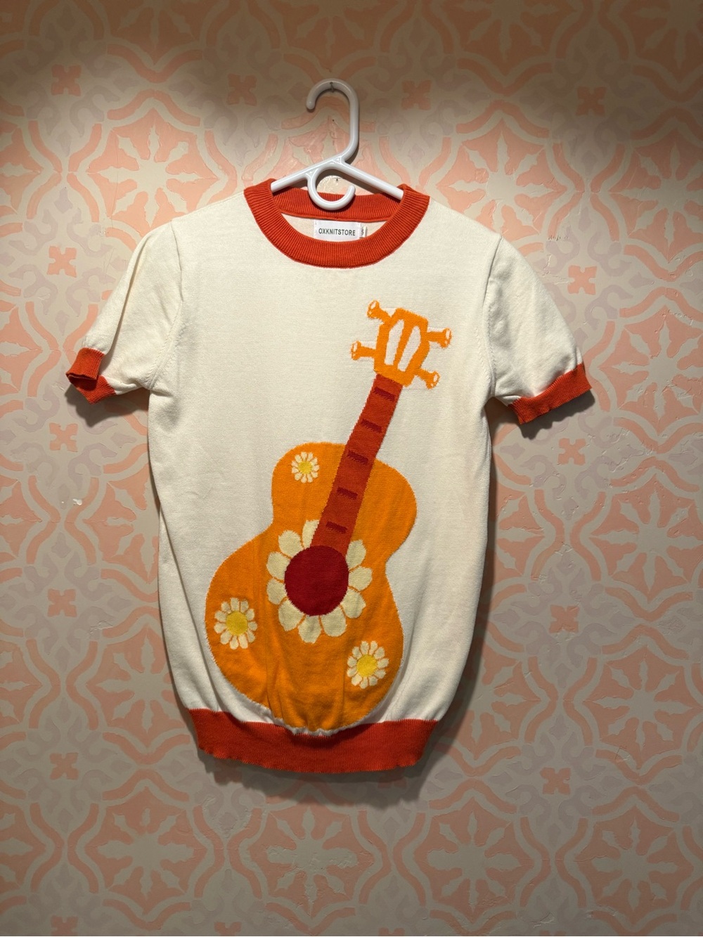 Cream Short-Sleeve Knit Tee with Orange Guitar Motif